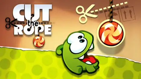 Cut the Rope - A green monster named Om Nom trying to eat a candy hanging from a rope, with scissors cutting the rope.